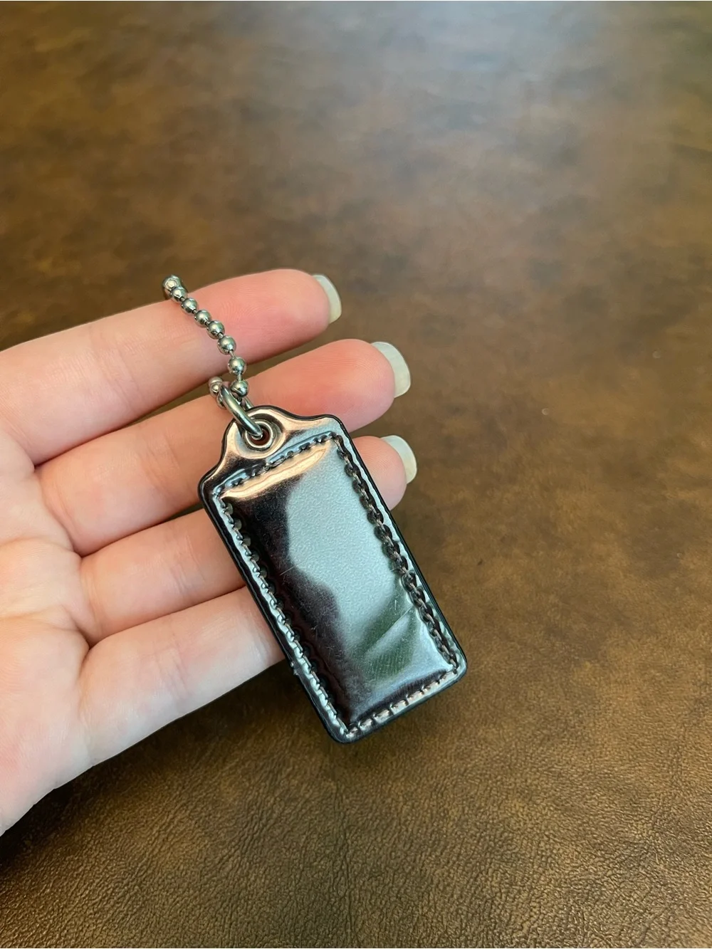 Coach silvery hangtag